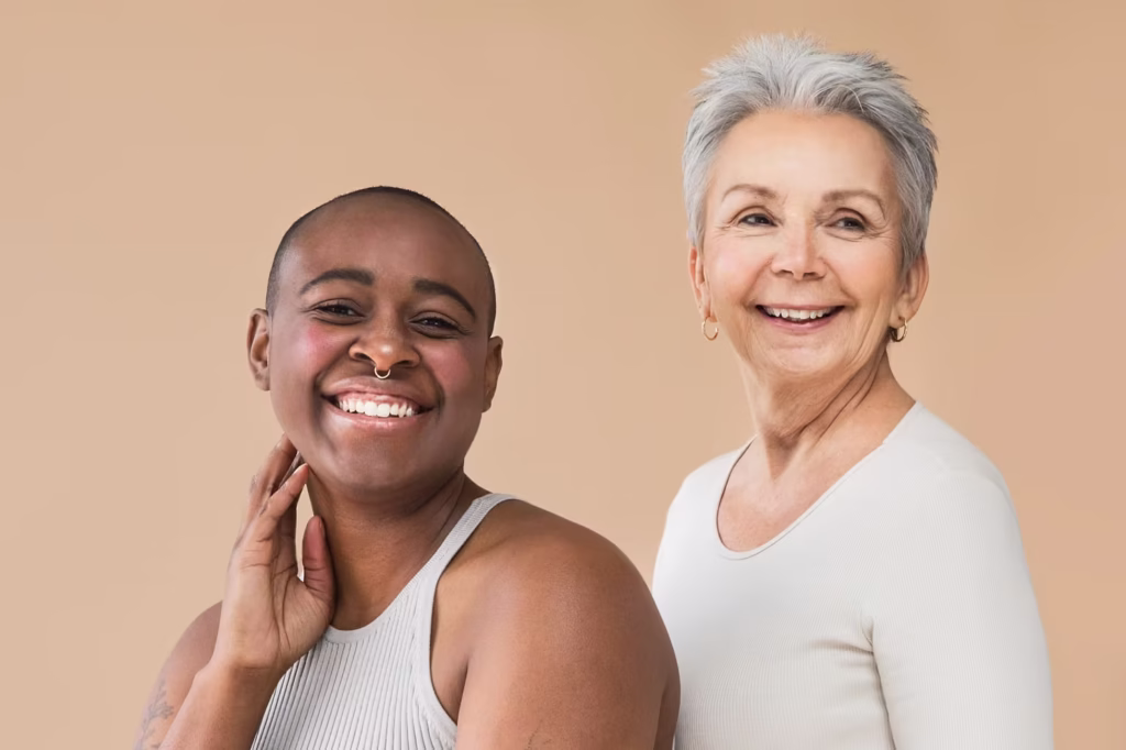 2 woman smiling with nice healthy skin